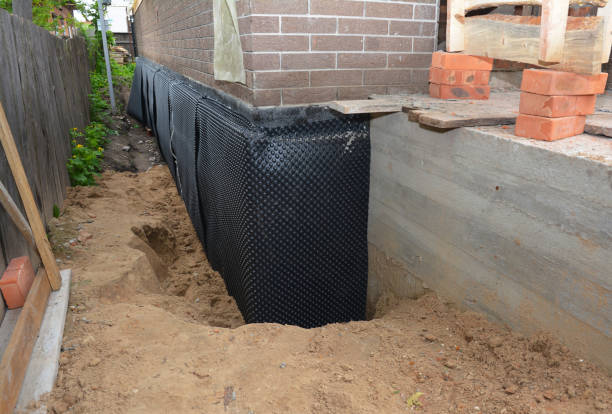 SJ Waterproofing Pros technician performing targeted Waterproofing assessment in Berkey, OH